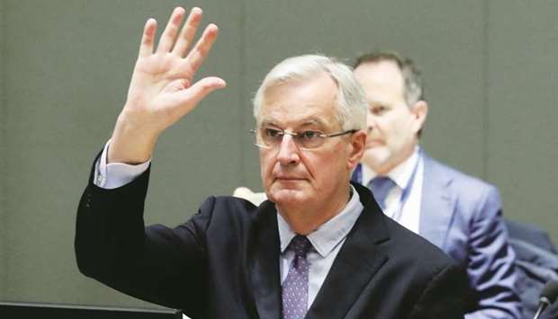 EU chief Brexit negotiator Michel Barnier raises his hand during a meeting of ambassadors of European Union governments in Brussels yesterday. An EU diplomat said following a briefing from Barnier that u201cthere might now be a narrow path to an agreement visible u2013 negotiators can clear the remaining hurdles in the next few daysu201d.