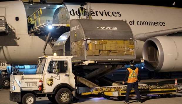 Canada's first batch of Pfizer/BioNTEch COVID-19 vaccines are unloaded from a UPS cargo plane at Montreal-Mirabel International Airport in Montreal, Quebec
