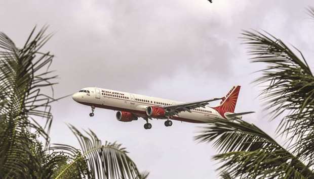 An Air India aircraft prepares to land at Chhatrapati Shivaji International Airport in Mumbai. Tata Sons Ltd has submitted an expression of interest to rescue the loss-making carrier, according to people with knowledge of the matter. A group of 219 Air India employees has also submitted a bid to purchase a majority stake.