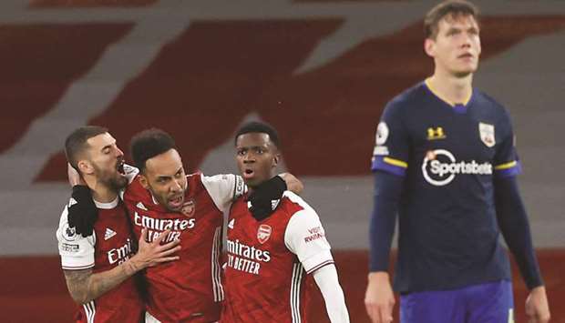Arsenalu2019s Pierre-Emerick Aubameyang (second left) celebrates with teammates after scoring against Southampton in the Premier League in London. (Reuters)