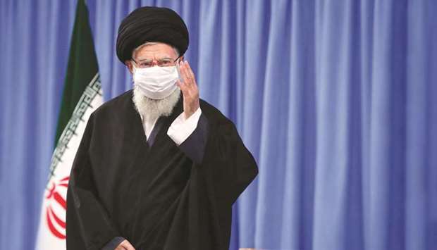 A handout picture shows Iranu2019s Supreme Leader Ayatollah Ali Khamenei waving yesterday during a meeting.