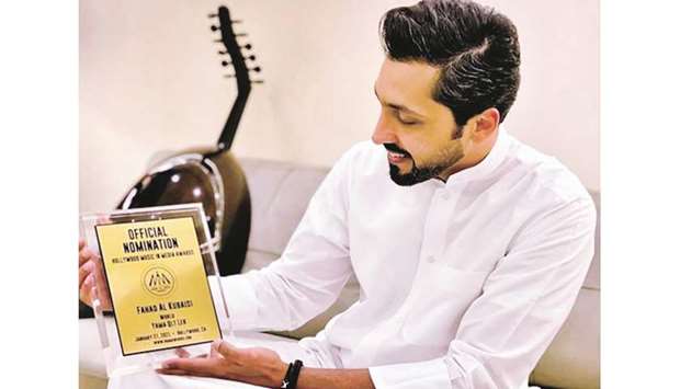 Fahad al-Kubaisi with the nomination plaque.