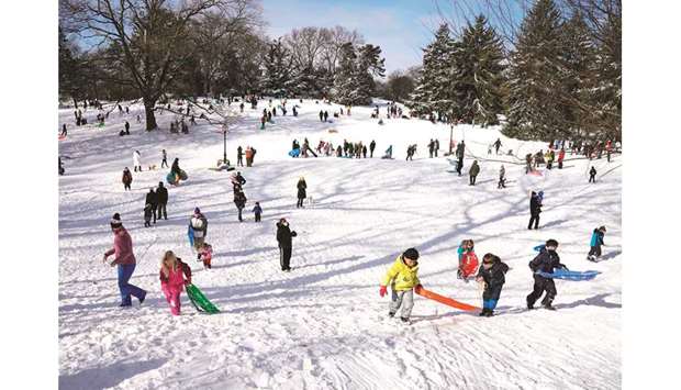 People go sledding on Central Parku2019s Pilgrim Hill in New York, yesterday, the morning after winter storm Gail hit the East coast.