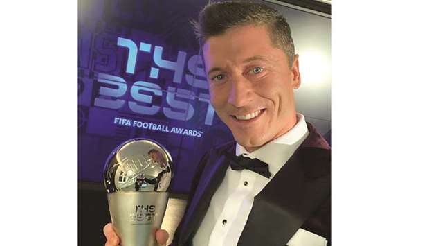 Bayern Munichu2019s Robert Lewandowski poses with The Best FIFA Menu2019s Player award yesterday. 