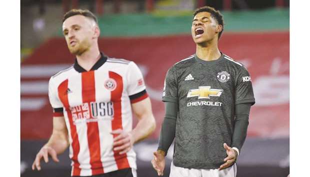 Manchester Unitedu2019s Marcus Rashford (R) celebrates next to Sheffield Unitedu2019s Jack Robinson on Thursday.