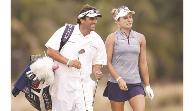 Lexi Thompson of the United States talks with her caddie and brother, Curtis Thompson, on the 18th hole during the first round of the CME Group Tour Championship at Tiburon Golf Club in Naples, Florida.