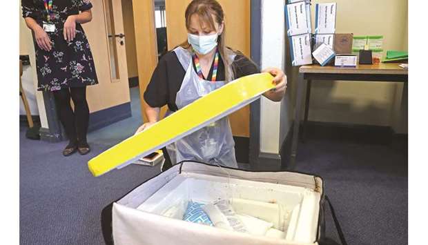 On delivery, the live Pfizer-BioNTech Covid-19 vaccine is transferred to a fridge for storage at the Gloucestershire Vaccination Centre at Gloucestershire Royal Hospital, central England.