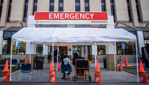 A tent is placed outside the Dignity Health - St. Mary Medical Center building to be used as a triage area for patients with Covid-19 symptoms in Long Beach, California