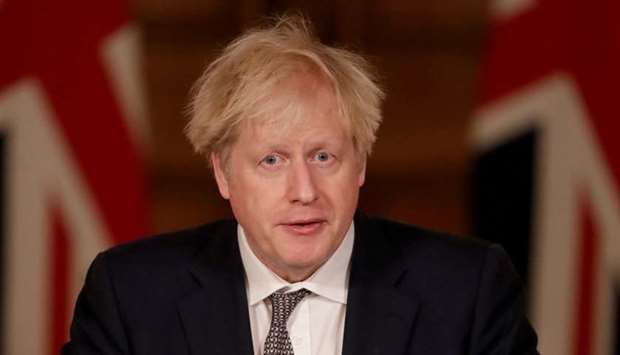 Britain's Prime Minister Boris Johnson speaks during a news conference about the ongoing situation with the coronavirus disease pandemic, inside 10 Downing Street, in London, Britain on December 16