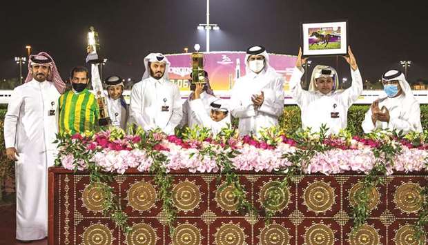 Asian and Qatar Equestrian Federation President and QREC Vice-Chairman Hamad bin Abdulrahman al-Attiyah (third from right) with the winners of Qatar Oaks (QA Group 3) after Glitter Queen won the 2,000m feature at Al Rayyan Park yesterday. PICTURES: Juhaim