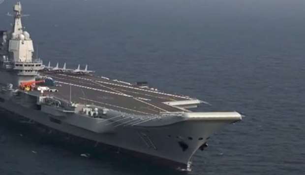 Taiwan's Defence Ministry said Chinese aircraft carrier Shandong, which was formally commissioned almost exactly one year ago, accompanied by four warships had set out from the northern Chinese port of Dalian on Thursday