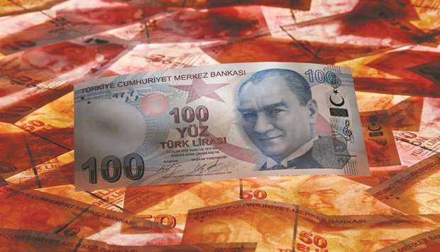 A 100 Turkish lira banknote is seen on top of 50 lira notes in this picture illustration in Istanbul (file). The lira is among the worldu2019s best performers against the dollar since early November; it gained for a fourth straight day on Friday, ending the week at 7.6232 against the US currency.