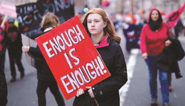 CLARION CALL: Climate activists hold placards as they march during a protest organised by the climate change action group Extinction Rebellion in London in February this year. (AFP)