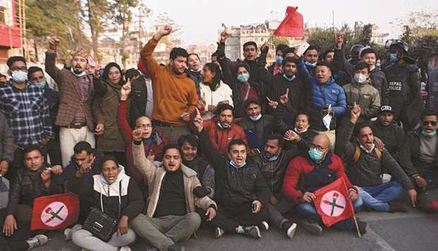 Protesters from the Nepalese Students Union, which is affiliated with the opposition Congress party shout slogans during a demonstration after the parliament was abruptly dissolved in Kathmandu, yesterday.
