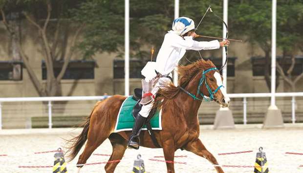 A participant takes part in the qualification skills test for the first Horseback Archery Championship (Al Nashaab Championship) at the Qatar Equestrian Federation arena.