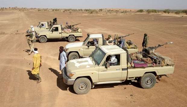 Fighters from a local armed group patrol around the town of Menaka, situated between Mali, Niger and Burkina Faso