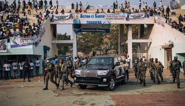 The motorcade of the President of the Central African Republic, arrives at the 20,000-seat stadium, for an electoral rally, escorted by the presidential guard, Russian mercenaries, and Rwandan UN peacekeepers, in Bangui