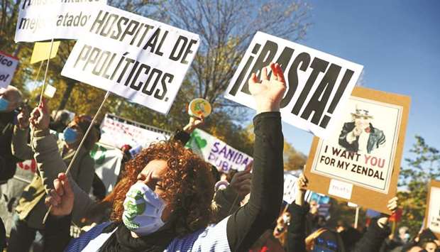 Health workers protest outside the Enfermera Isabel Zendal hospital during its inauguration.