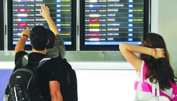 Travelers look at a departure schedule at Suvarnabhumi International Airport in Bangkok (file). Connectivity in some regions such as Asia Pacific and North America proved to be more resilient due to the presence of sizable domestic aviation markets.