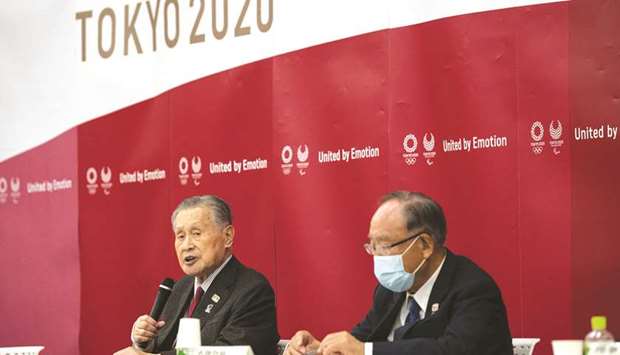 Tokyo 2020 President Yoshiro Mori (L) speaks during the opening remarks session of the Tokyo 2020 Olympics executive board meeting in Tokyo yesterday.