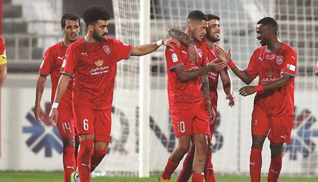 Al Duhailu2019s Edmilson (centre) celebrates with teammates after scoring against Al Khor in the QNB Stars League.