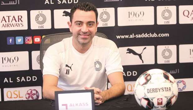 Al Saddu2019s head coach Xavi Hernandez is all smiles at a press conference yesterday.