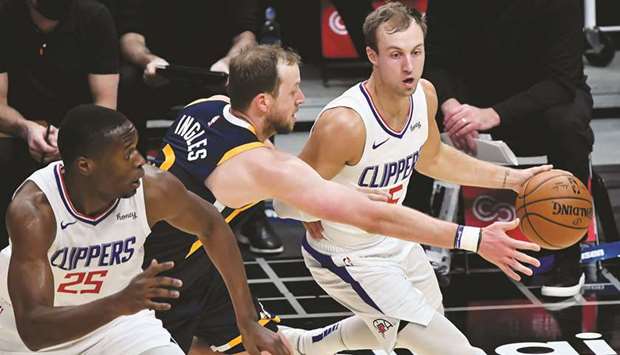 LA Clippers guard Luke Kennard (right) drives past Utah Jazz forward Joe Ingles (centre) during the game at Staples Center in Los Angeles, California, United States, last Thursday. (USA TODAY Sports)