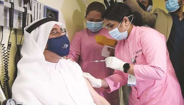 Dr Abdulla al-Kubaisi, being administered the Covid-19 vaccine at Al Wajba Health Centre on Wednesday. PICTURE: Ram Chand