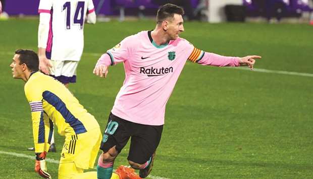 Barcelonau2019s Argentine forward Lionel Messi celebrates after scoring against Real Valladolid in the La Liga at the Jose Zorilla stadium in Valladolid, Spain, on Tuesday night. (AFP)