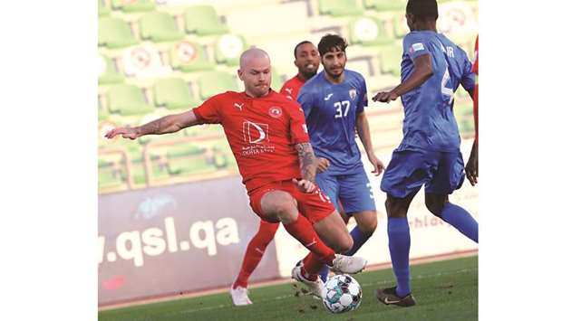 Aron Gunnarsson (left) scored a spectacular goal from 70 yards as Al Arabi defeated Al Kharaitiyat 3-1.