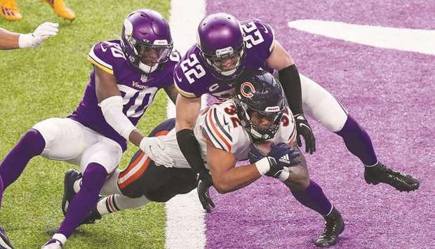 Chicago Bears running back David Montgomery (bottom) runs the ball for a touchdown in the third quarter against Minnesota Vikings defensive back Harrison Smith (top, right) at US Bank Stadium in Minneapolis, Minnesota, United States, on Sunday. (USA TODAY Sports)