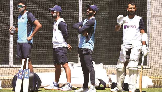 Indiau2019s Ravichandran Ashwin (L), Ajinkya Rahane (2nd L), Ravindra Jadeja (2nd R) and Cheteshwar Pujara (R) watch teammates during a training session in Melbourne yesterday.