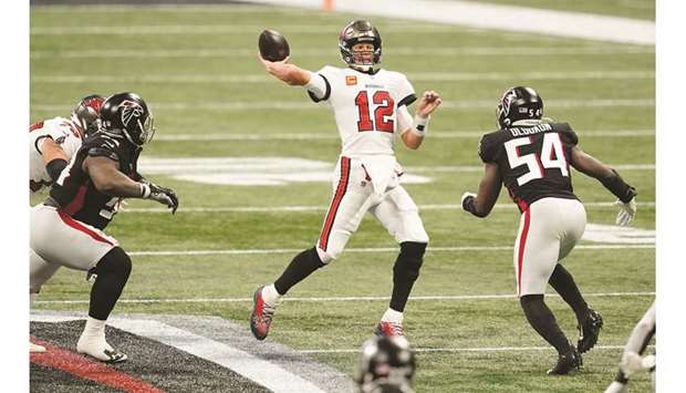 Tampa Bay Buccaneers quarterback Tom Brady (centre) throws a pass against the Atlanta Falcons in the first half of a NFL game at Mercedes Benz Stadium in Atlanta, Georgia, United States, on Sunday. (USA TODAY Sports)