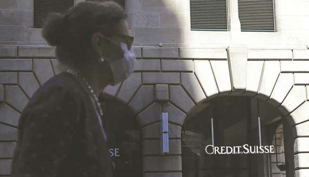 A pedestrian walks past a Credit Suisse Group bank branch in Zurich. Credit Suisse alone is preparing to launch seven to eight new special purpose acquisition companies or SPACs in January, 2021.