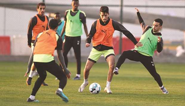Al Duhail and Al Ahli (right) players train on the eve of their QNB Stars League match.