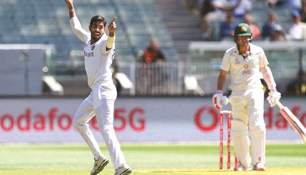 Indiau2019s Jasprit Bumrah (L) appeals successfully for the wicket of Australiau2019s Joe Burns (R) on the first day of the second Test match at the MCG in Melbourne yesterday.