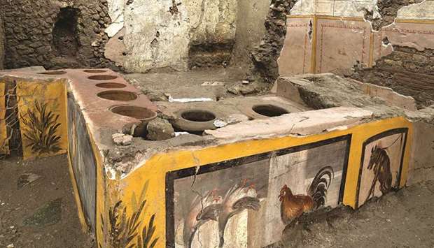 Frescoes on an ancient counter discovered during excavations in Pompeii are seen in this handout picture.