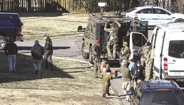 Law enforcement officers investigate the house belonging to a  u2018person of interestu2019 in the Nashville bombing.