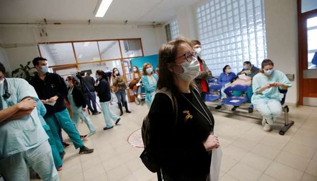Medical workers wait to receive the Pfizer-BioNTech coronavirus disease vaccine at Santa Maria hospital in Lisbon, Portugal