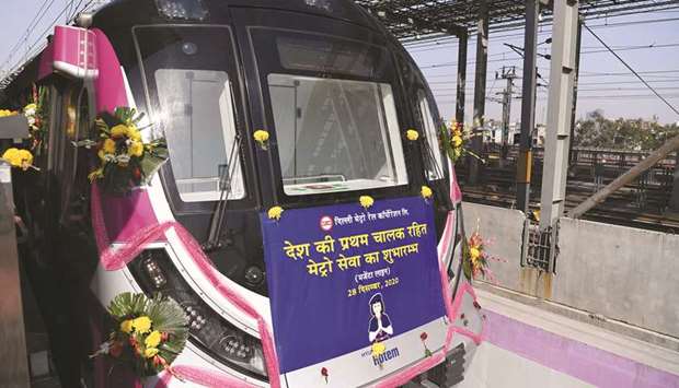 Flowers adorn the front of Indiau2019s first driverless metro train at a metro station during its inauguration in New Delhi yesterday.
