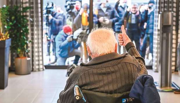 Jos Hermans, 96, who is the first in Belgium to receive a Pfizer-BioNTech Covid-19  vaccine, gives a thumb-up yesterday in front of journalists at the u2018Woonzorgcentrum  Sint-Pietersu2019 rest home in Puurs, in Belgiumu2019s Flemish region.