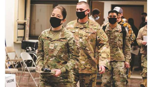 Service members of the United States Forces Korea prepare to receive the first round of the Moderna vaccine at Osan Air Base, south of Seoul.