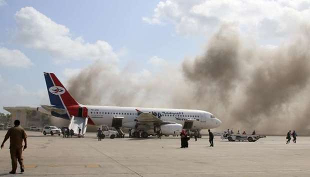 Dust rises after explosions hit Aden airport, upon the arrival of the newly-formed Yemeni government in Aden, Yemen. Reuters
