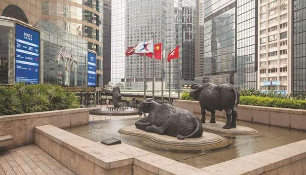 Sculptures stand outside the Hong Kong Stock Exchange. The Hang Seng index closed up 2.2% to 27,147.11 points yesterday.