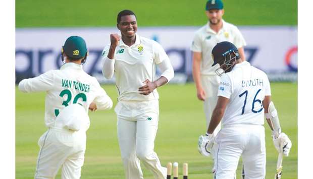 South Africau2019s Lungi Ngidi (2nd L) celebrates a wicket in Centurion.