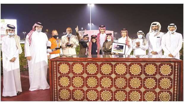 Qatar Racing and Equestrian Clubu2019s Abdulla Rashid al-Kubaisi (third from right) with the winners of Dukhan Cup after Injaaz Studu2019s Gaby De Faust won the 1700m run at Al Rayyan Park yesterday. PICTURES: Juhaim
