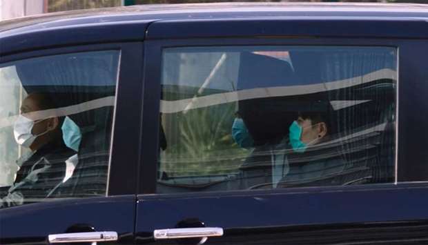 Hong Kong activists detained in mainland China over an illegal border crossing is seen in a vehicle after a transfer conducted at the China-Hong Kong border of Shenzhen Bay Port , in Hong Kong