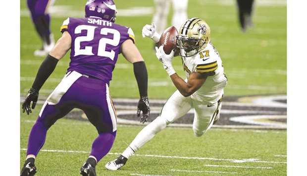 In this December 25, 2020, picture, New Orleans Saints wide receiver Emmanuel Sanders (right) makes a catch in front of Minnesota Vikings strong safety Harrison Smith in the game at the Mercedes Benz Superdome in New Orleans, Louisiana, United States. (USA TODAY Sports)
