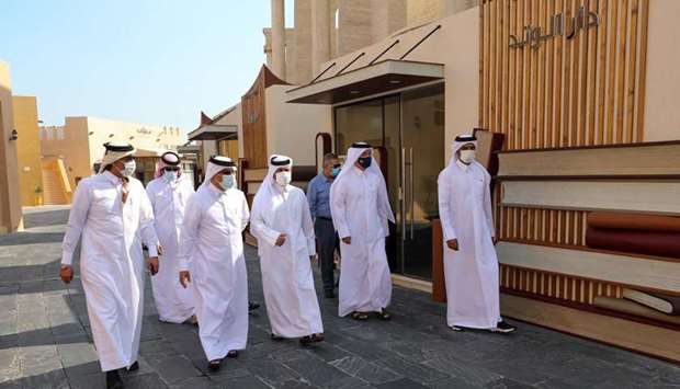 Katara general manager Dr Khaled bin Ibrahim al-Sulaiti and other dignitaries touring the 'Ibn Rayb' Cultural Street after its opening.