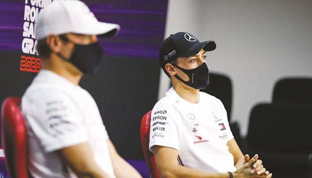 Mercedes drivers Valtteri Bottas (left) and George Russell, who replaced Lewis Hamilton after the champion tested positive for Covid-19, attend a press conference ahead of the Sakhir Grand Prix yesterday. (AFP)